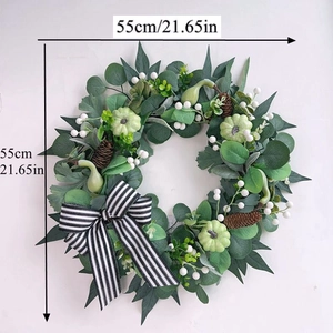Detail of 21.65 inch faux pumpkin wreath with pine cones and black-white striped bow
