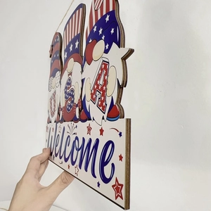Side view detail of layered wood USA gnome welcome sign showing durable plywood texture