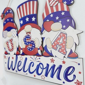Detail of multi-layered wooden 4th of July gnome welcome sign with USA lettering