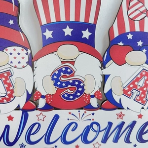 Detail of Independence Day wooden gnome sign with USA letters and blue Welcome text