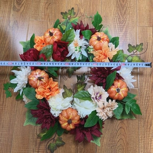 Close-up measuring pumpkin dahlia wreath showing 45cm diameter size for autumn decor
