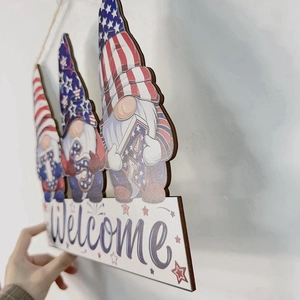 Close-up detail of USA Gnome wooden welcome sign with Independence Day theme
