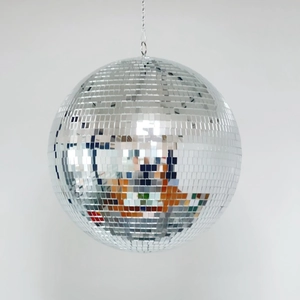 Close-up of a silver disco ball showing square glass mirror tiles and a hanging chain