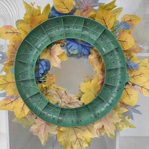 Rear view of autumn blue pumpkin wreath showing durable green plastic base structure