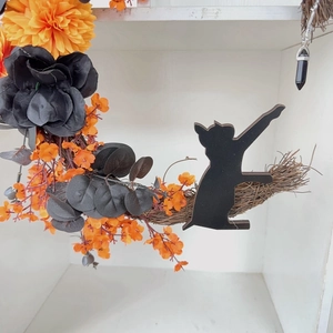 Detailed Halloween wreath with orange chrysanthemums, black roses, and cat silhouette