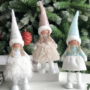 Detailed view of three glitter angel dolls with sequin hats and plush dresses for Christmas