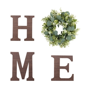 Rustic HOME wall decor set featuring wooden letters H, M, E and a green eucalyptus wreath