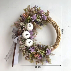 Close-up of 45cm autumn wreath with white pumpkins, lavender silk flowers and ribbons