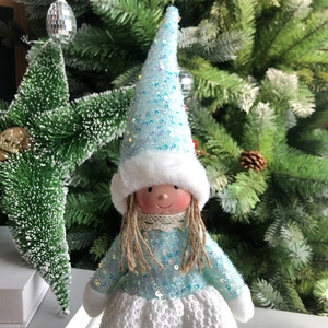 Detail of blue sequin Christmas angel doll with white knitted dress and furry hat