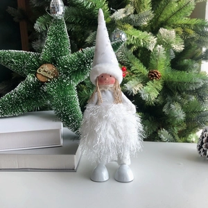 Detailed view of white Christmas angel doll with sequin hat and fluffy feather dress