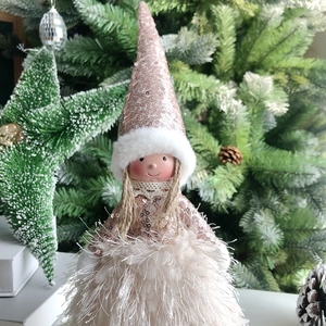 Detail of Christmas angel doll with champagne sequins and soft feather skirt decor