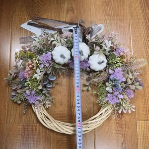 Detailed top view of 35cm artificial white pumpkin wreath with purple flowers and ribbons
