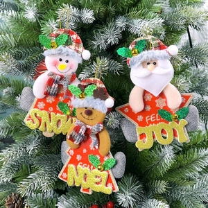 Close-up of Christmas ornaments with Snowman, Elk and Santa icons on red star bases