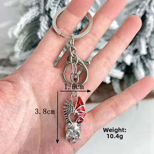 Porte-clés tête de mort gothique avec ailes rouges et fermoir en métal, longueur 3,8 cm