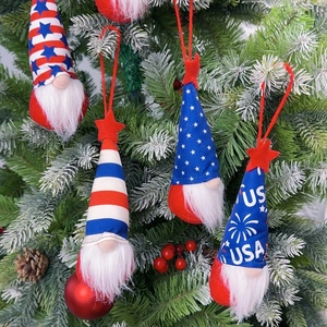 Patriotic USA gnomes with stars and stripes hanging on a festive tree branch