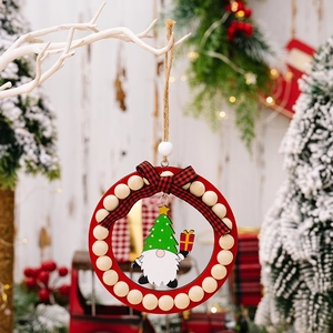 Detail of Christmas gnome wood ornament with red ring, wooden beads and checkered bow