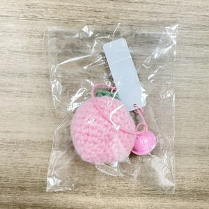 Handmade knitted pink peach keychain with green leaf, small pink bell and a carry strap