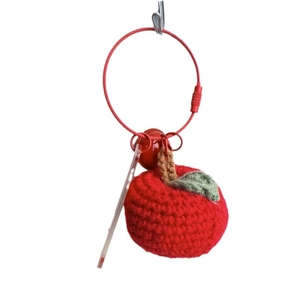 Handmade knitted red apple keychain with green leaf and bell on a red wire loop
