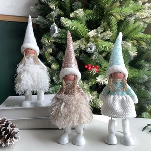 Close-up of sequined elf dolls in white, rose gold and blue for Christmas party decoration