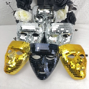Detail shot of sparkling silver, gold and black disco ball mirror masks with elastic straps