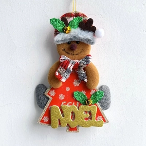 Close-up of reindeer Christmas tree ornament with golden NOEL lettering and tiny bell