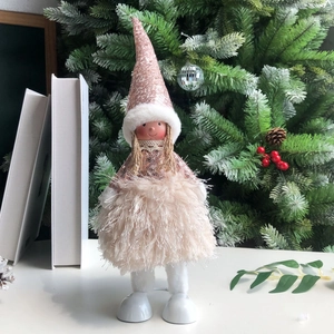 Detail of Christmas angel doll with champagne pink sequins, lace, and plush fur skirt
