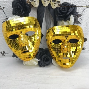 Close-up of golden disco ball mirror mask with square glass tiles for Halloween party