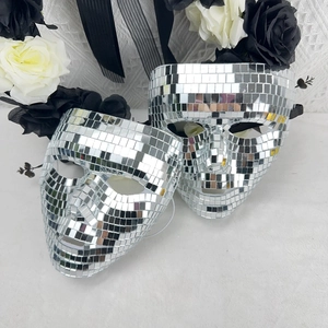 Close-up detail of silver disco ball mosaic mask with reflective mirror glass tiles