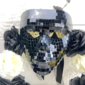 Macro shot of disco style silver mirror mask with detailed square glass tiles