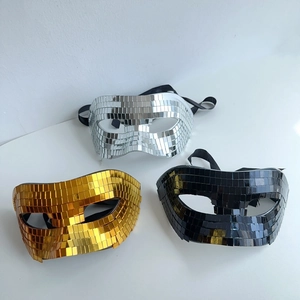 Detailed view of silver, gold, and black disco ball mirror masks with elastic straps