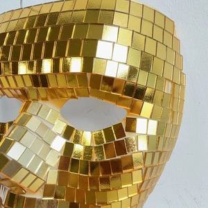 Close-up of golden disco ball mosaic mask with reflective mirror glass tiles for parties