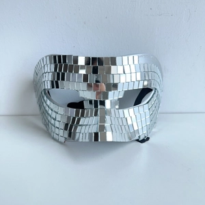 Detail of handcrafted silver disco ball mask with reflective square glass mirror tiles