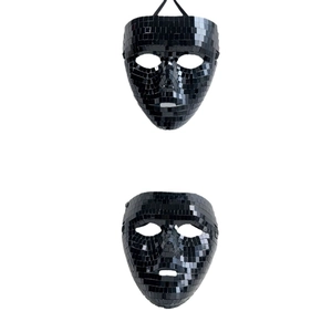 Detail of black mosaic mirror tiles on disco ball mask with reflective glass surface