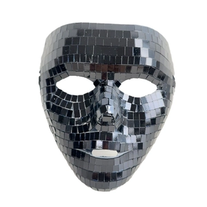 Detail view of shiny black glass mirror tiles on a handcrafted disco party mask