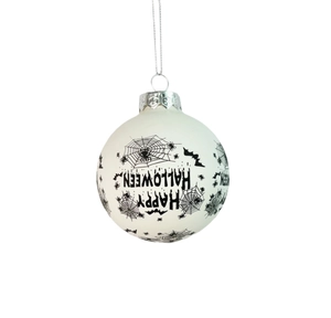 Close-up of white Halloween ornament with black spider web and Happy Halloween text