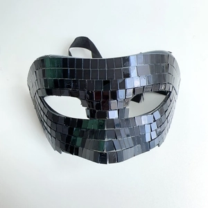 Detailed close-up of disco ball mask with reflective black square mirror tiles and elastic strap