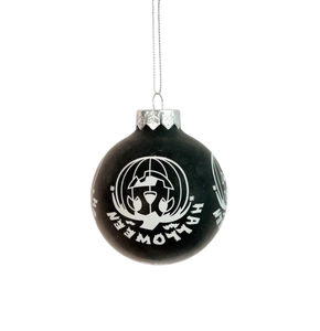 Detailed macro view of black Halloween ornament ball with silver cap and hanging string