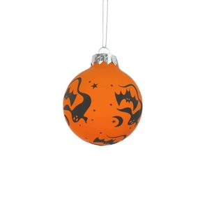 Detail of orange Halloween ornament ball with black bat and ghost silhouette patterns