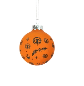 Detail of orange Halloween ornament with black pumpkin, bat, and skull patterns