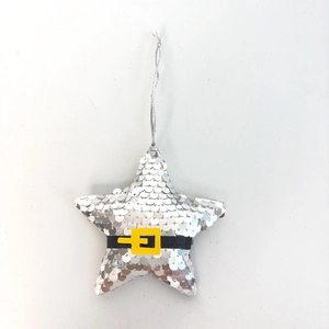 Close-up of star ornament with silver sequins and Santa belt detail for Christmas tree
