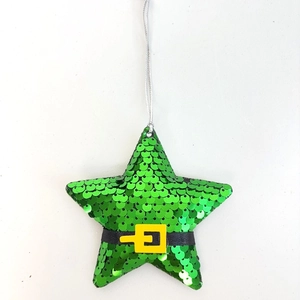 Macro shot of a green sequined star ornament with a black belt and silver hanging string
