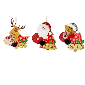 Three Christmas plush ornaments featuring Santa, reindeer, and bear with gold lettering