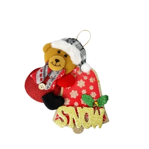 Plush Christmas bear ornament with red bell base and glittery golden SNOW text detail