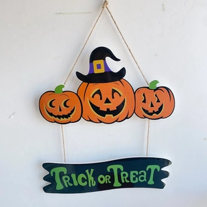 Wooden Halloween pumpkin hanging sign with wizard hat and Trick or Treat banner