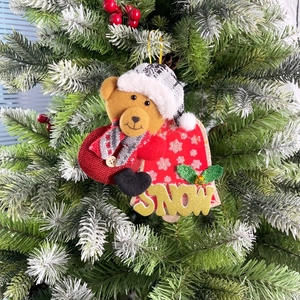 Christmas plush bear hanging ornament with a red bell design and SNOW glitter lettering