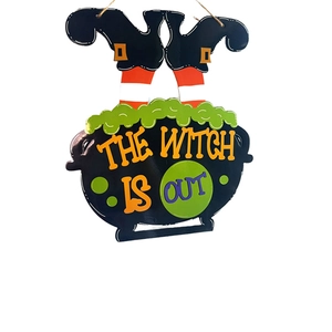 Halloween hanging witch cauldron sign with The Witch Is Out text and striped legs
