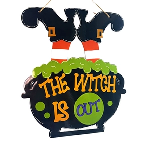Close-up of Halloween witch cauldron sign with The Witch Is Out text and hanging legs