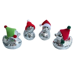 Set of four shiny disco ball ducks with festive Christmas hats for holiday home decor