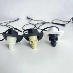 Three spooky skull pendants with cowboy hats for Halloween party decorations and necklace