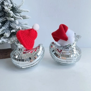 Macro detail of disco ball foam ducks with silver mirrors and mini Santa hats